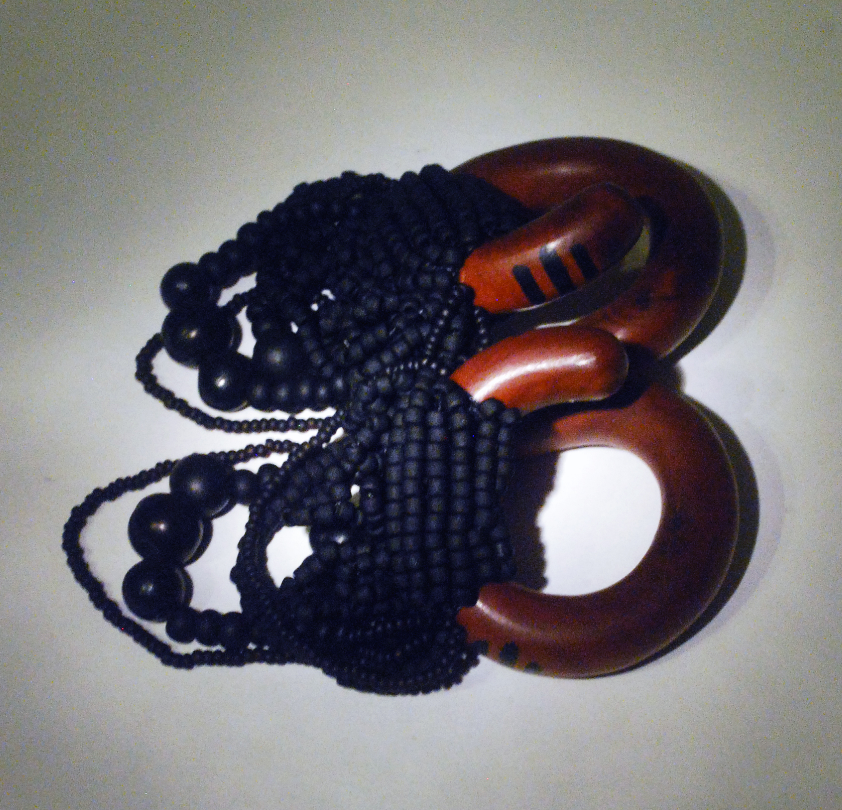 black glass beadweaving on sawa wood coils