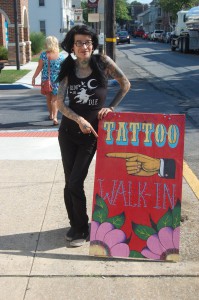 female tattoo artist at shop